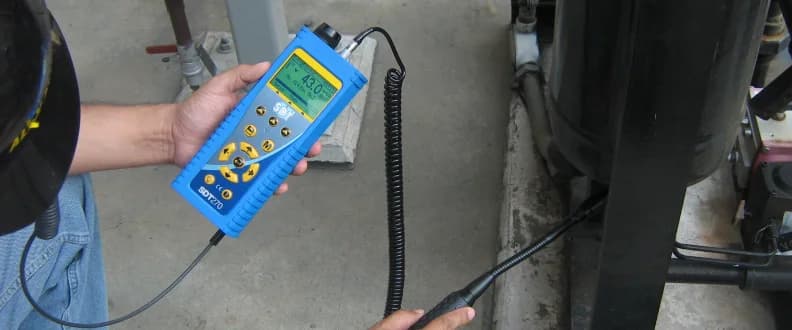 Hunting a compressed air leak on a pipeline: a flexible SDT sensor along the joints, signal level on the instrument screen. Photo: SDT Ultrasound Solutions